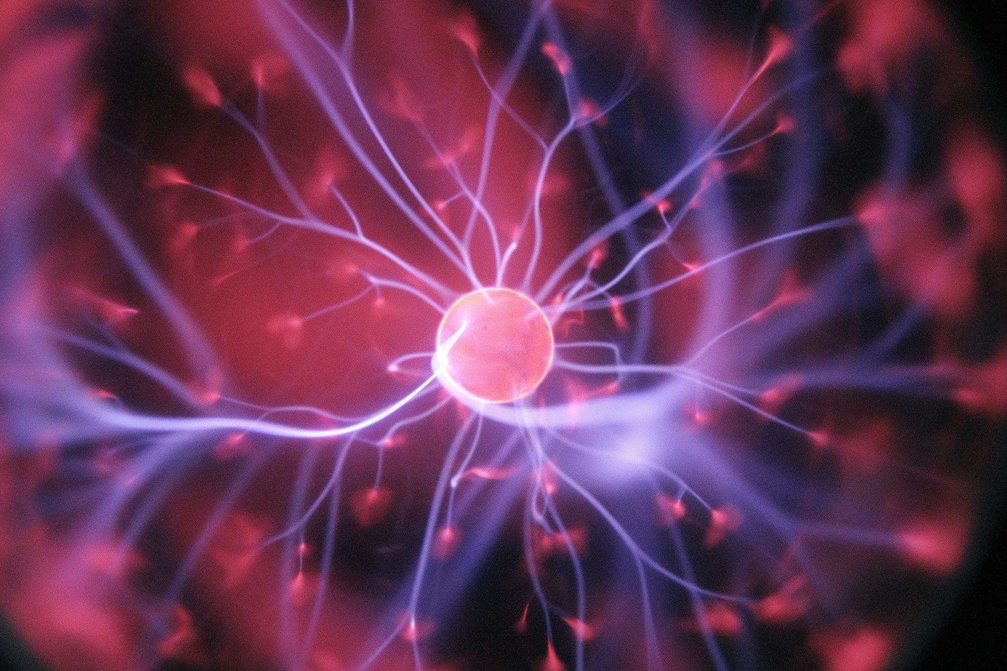 Threads of violet light branching out from a glowing centre