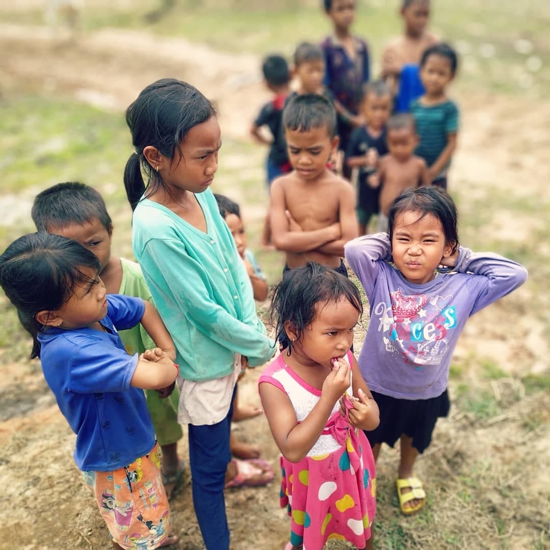 Village children standing together in the sun